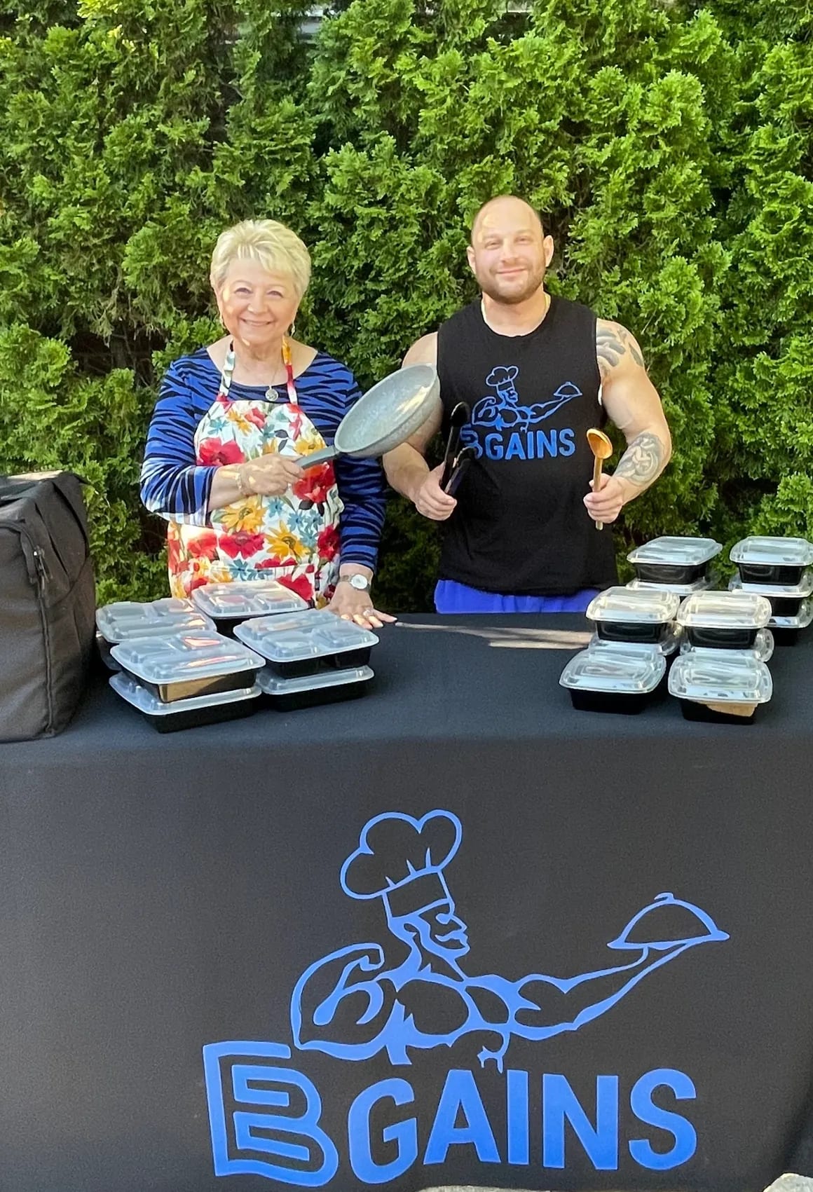 Eitan and family standing together at the EBGAINS booth